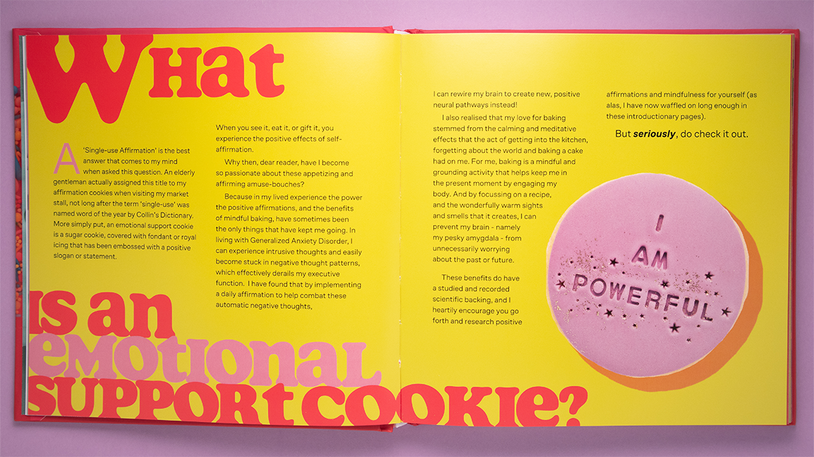 open book with yellow background, text and purple cookie on purple background